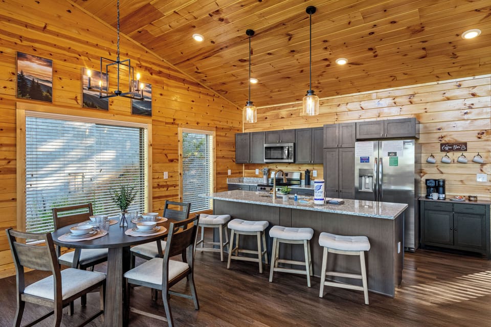 Open kitchen with granite countertops & stainless steel