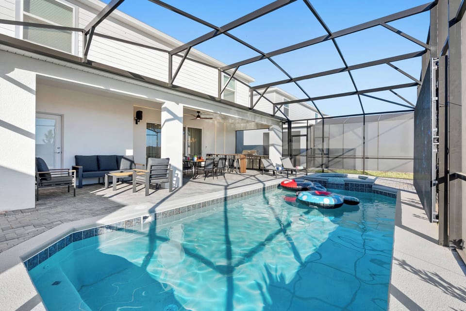 Experience your private oasis with a sparkling pool enclosed for your comfort, ideal for sunny days. Relax in the cozy seating area and soak in the beautiful outdoor ambiance.