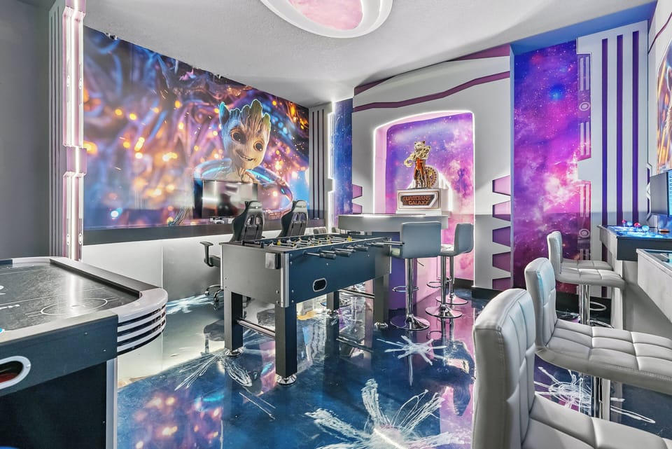 Enjoy a vibrant entertainment room with lively wall art and shiny floors that enhance its energetic vibe. With stylish seating and a modern game table, this space invites fun and socializing for a truly memorable stay.