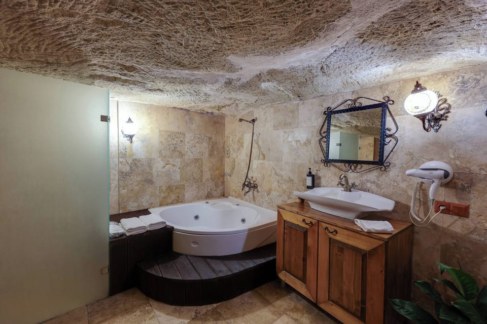 Hidden Library Magara Suite | Bathroom | Shower, designer toiletries, hair dryer, towels