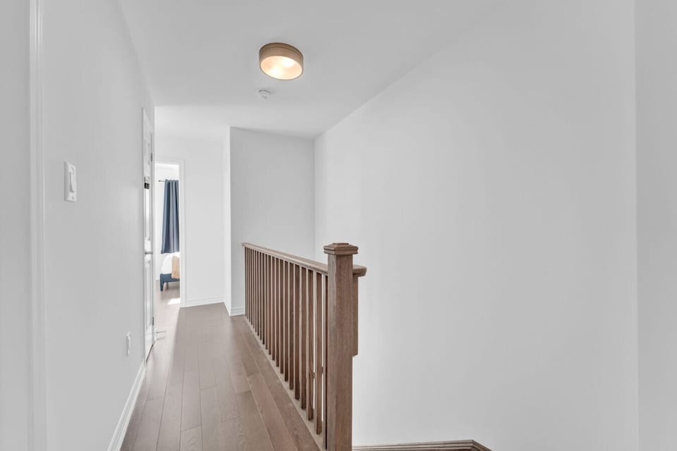 Retreat to a quiet upper level where comfort awaits at every turn. This serene hallway connects your private quarters, offering a peaceful transition between a day of adventure and a restful night of undisturbed sleep.