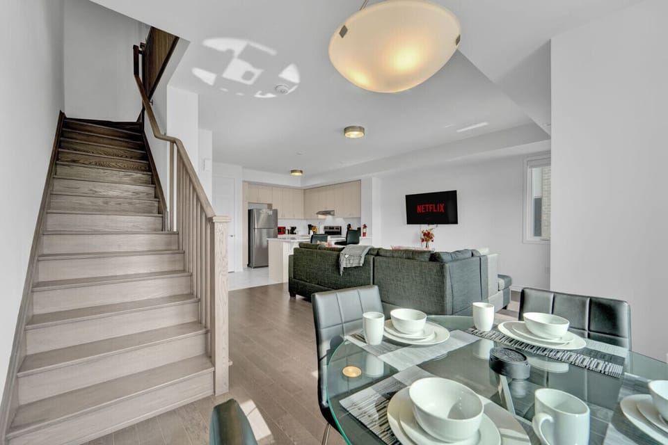 Gather around the table for a memorable meal in this inviting open concept living space. Whether it is a slow morning breakfast or an evening of shared stories, this home is designed for connection and effortless hosting.