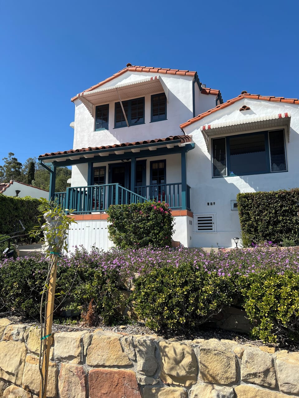 Back side of property and the upstairs is location to bedroom