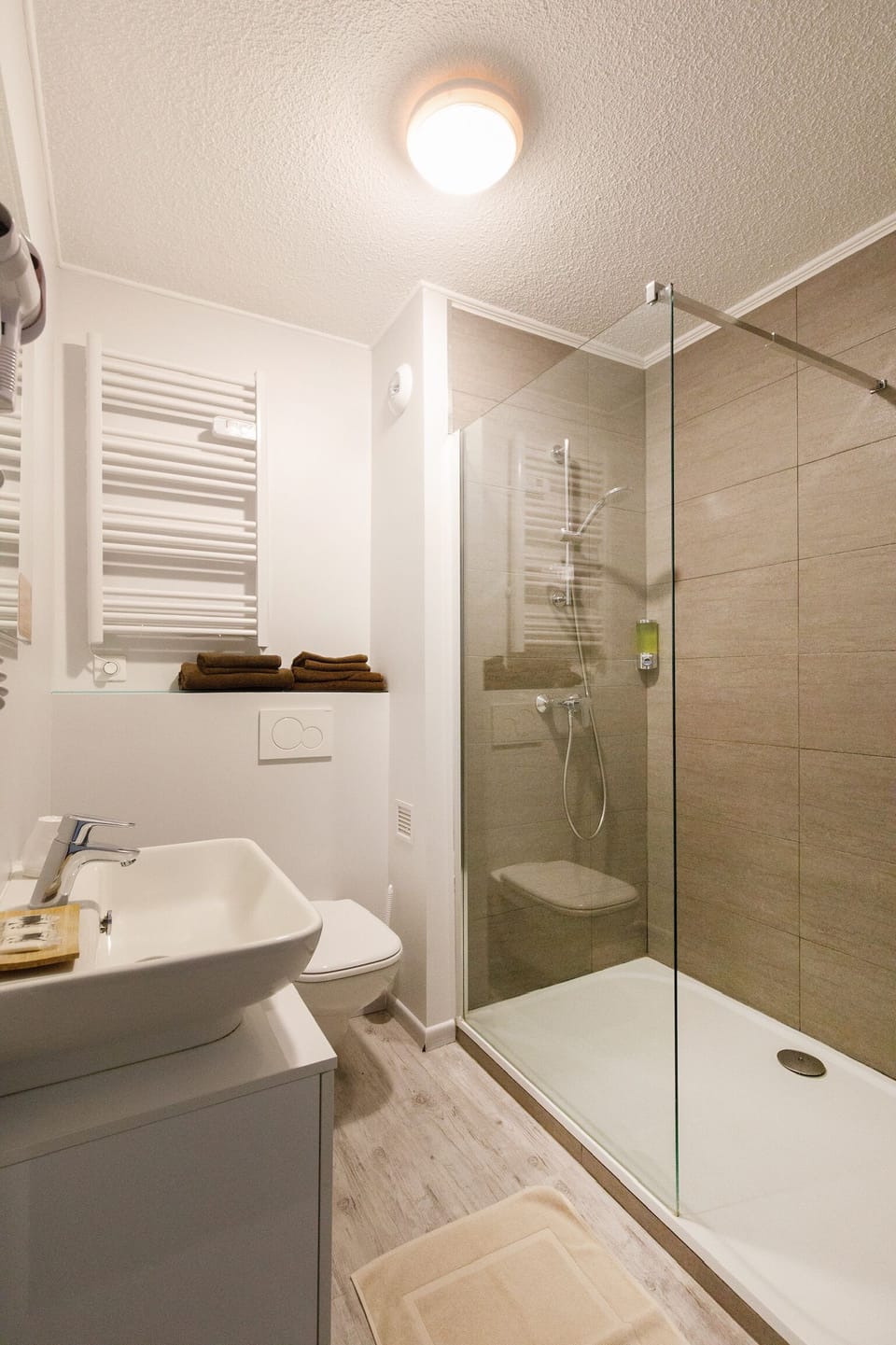 Shower, eco-friendly toiletries, hair dryer, towels