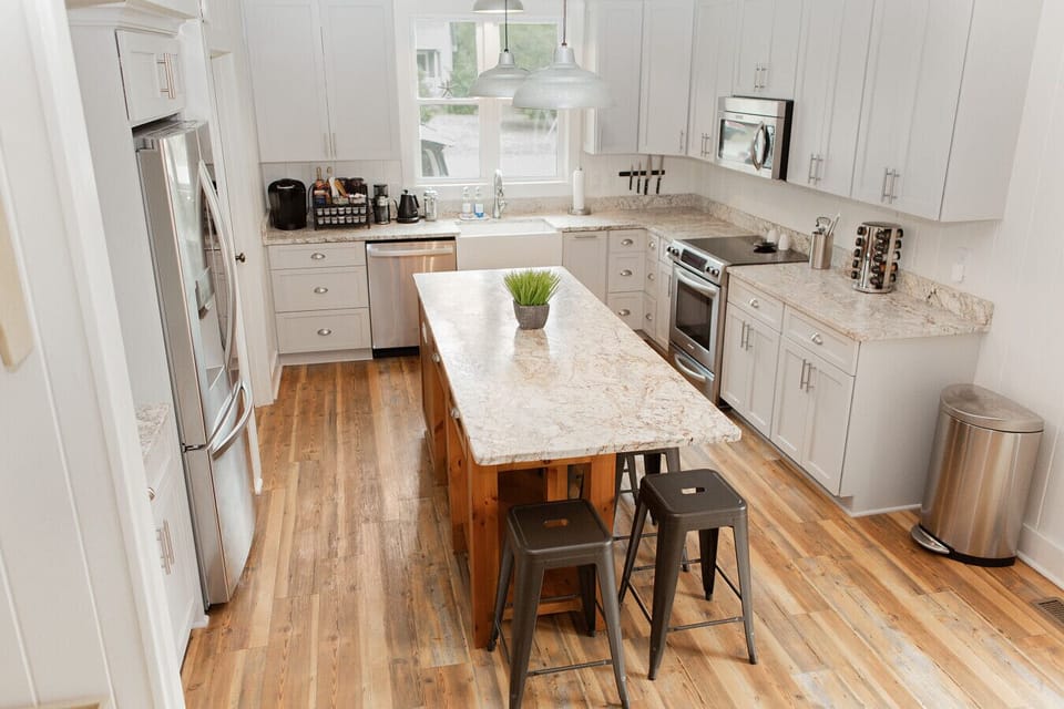 Well stocked chefs kitchen with everything you need to cook a big meal together.