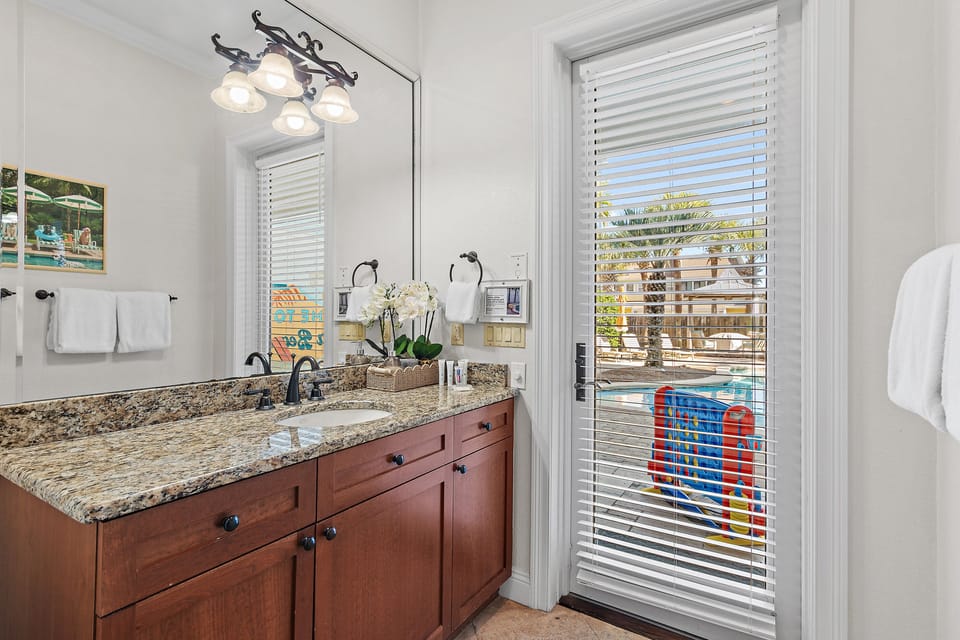 Jack and Jill Bathroom with shower tub combo shared by Bedrooms 1 and 2