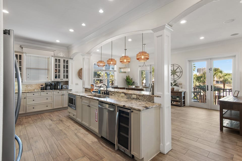 GOURMET, FULLY-STOCKED KITCHEN: Cook in style with upscale appliances, custom cabinetry, and high quality cookware