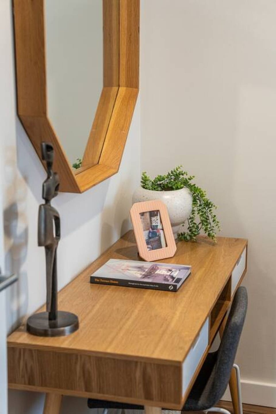 A desk in bedroom two caters to remote work and study.