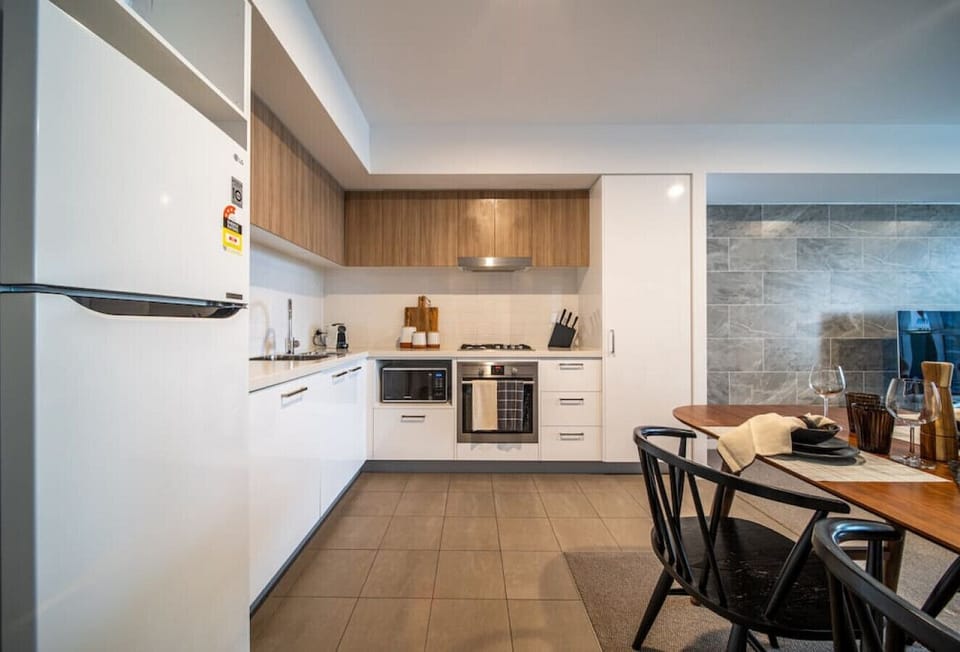 Cook with ease in the modern kitchen and gather around the dining table for shared meals or takeaway nights in.