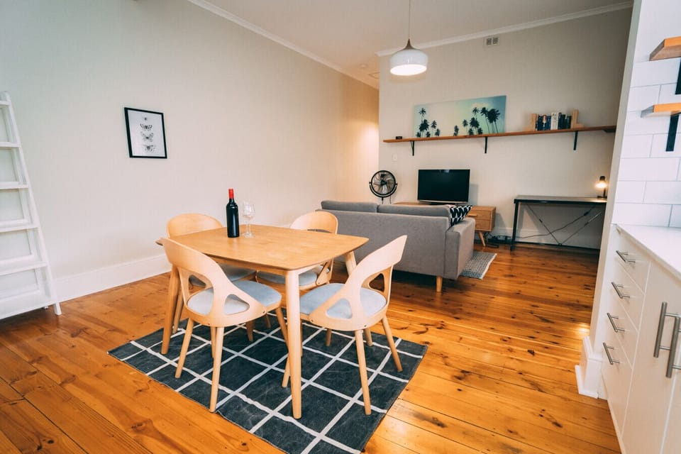 Gather around the dining table for casual meals and conversation in a space that feels open and inviting.