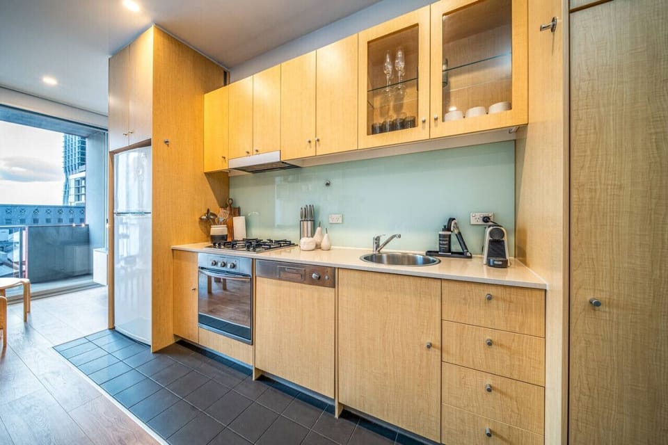 Cook with ease in the fully equipped kitchen, complete with gas cooktop, oven, and all the essentials for a night in.
