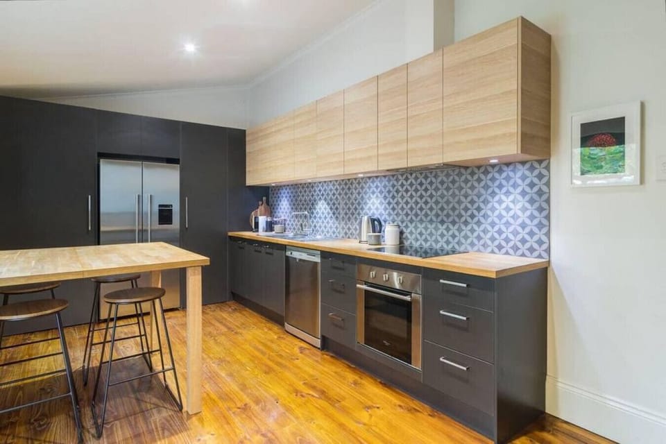 Brew fresh Nespresso, prep meals with ease, or gather around the high-top table before dining alfresco in the courtyard — the kitchen is stylish, functional, and fully equipped.
