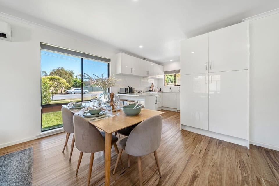 Gather for shared meals in the dining area, where conversation flows easily around the five-seater table.