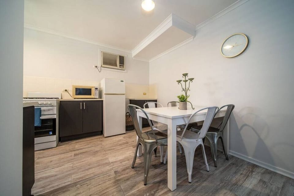 Enjoy an easy flow between the open-plan kitchen and dining area, where preparing meals and gathering around the table feel naturally connected.