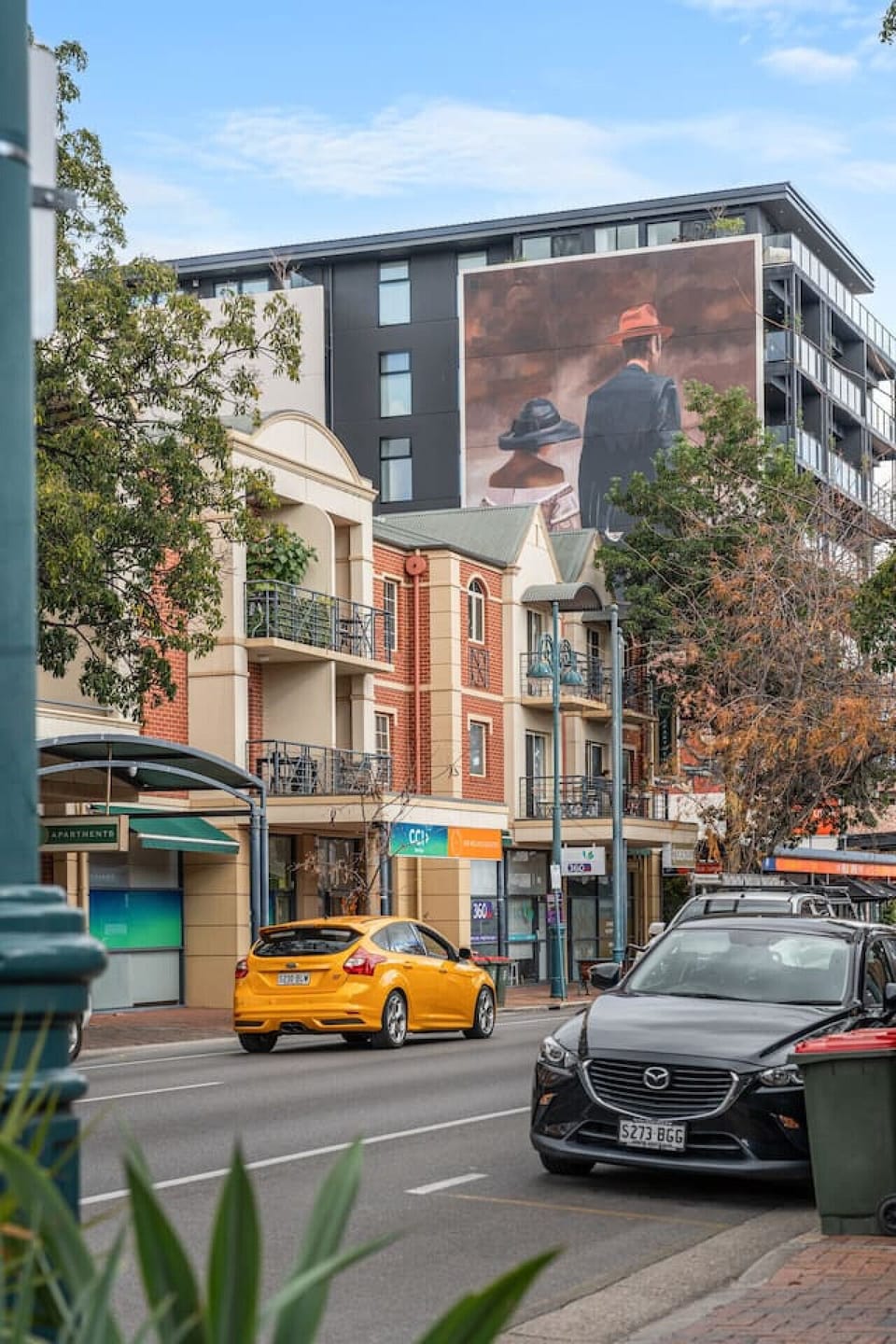 Step outside and immerse yourself in the energy of this vibrant, café-lined street.