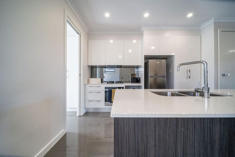 Prepare meals in a well-equipped kitchen designed for both convenience and comfort.