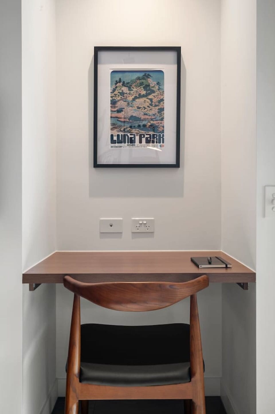 Work from home at this study nook that has a monitor you can link up to your laptop