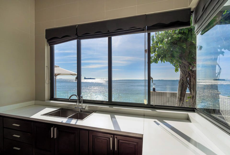 Luxury Villa, 4 Bedrooms, Ocean View, Beachfront | Living area | 42-inch flat-screen TV with cable channels