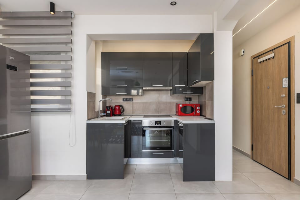 Apartment, Balcony, City View | Private kitchen | Espresso maker, electric kettle