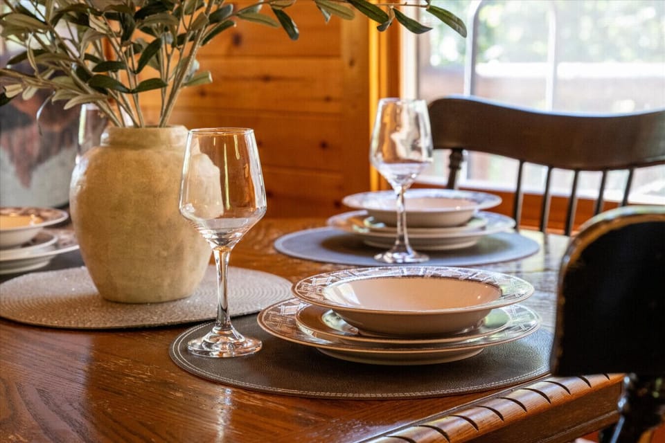 A charming dining setup ready for shared meals, morning coffee, or winding down with a glass of wine after exploring the Smokies.