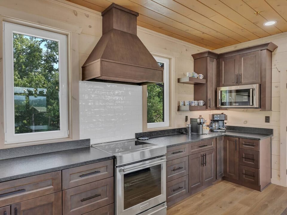The spacious kitchen is designed for creating and sharing—prepare home-cooked meals while staying connected to the laughter in the living and dining areas.