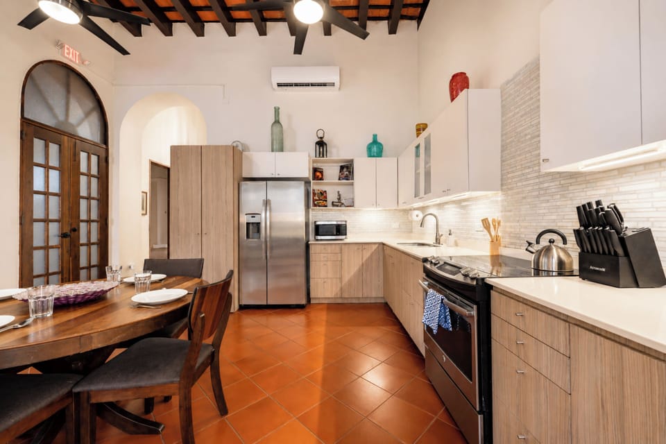 Full kitchen with modern appliances, generous counter space, and a second dining