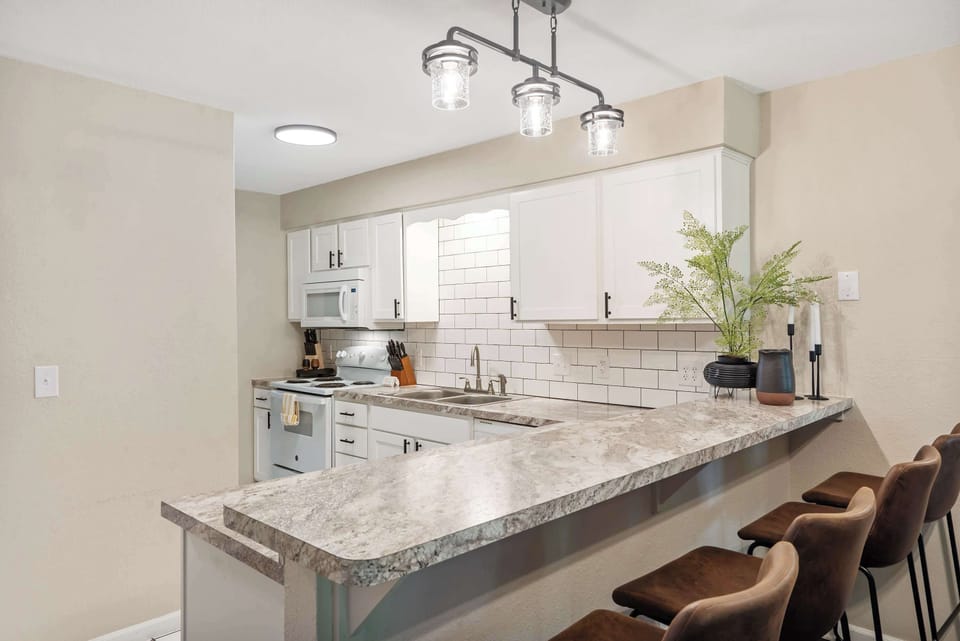 Condo, Multiple Beds, Patio, Garden View (Coffman Escape) | Private kitchen | Fridge, microwave, oven, stovetop