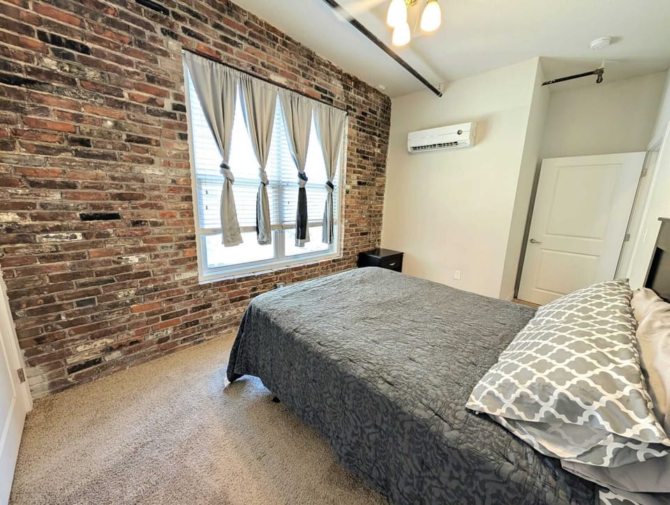 This queen-sized bedroom offers the perfect retreat for relaxation and comfort.