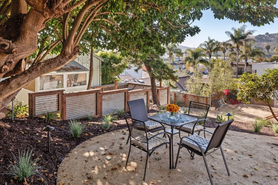 Private garden courtyard with outdoor dining area