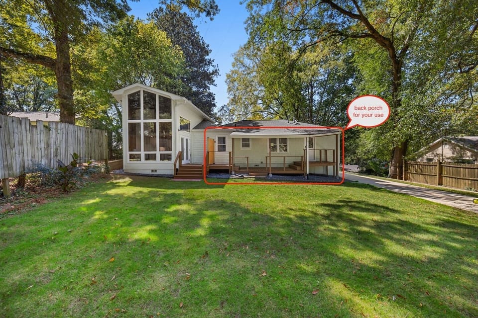 The lawn is shared, but the deck space is separated by a privacy fence.  Outdoor furniture has been added since this picture was taken.  There is seating for 4; a loveseat, two outdoor armchairs and a coffee table.
