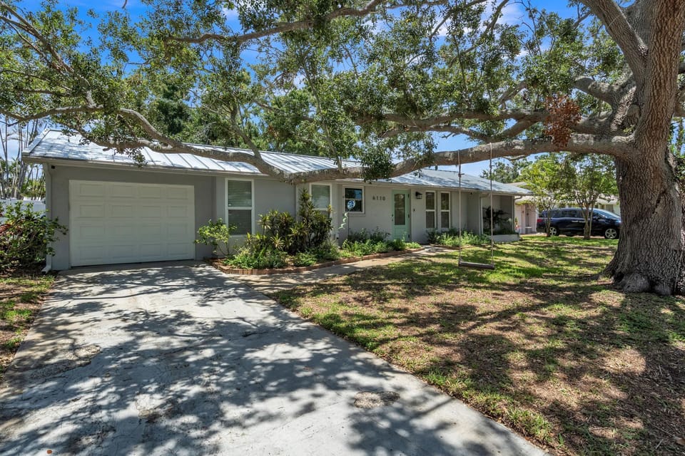 Exterior view of sweet Oaks cottage with ample parking in driveway