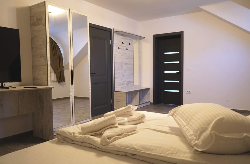 Deluxe Quadruple Room, Mountain View | Desk, laptop workspace, iron/ironing board, free WiFi