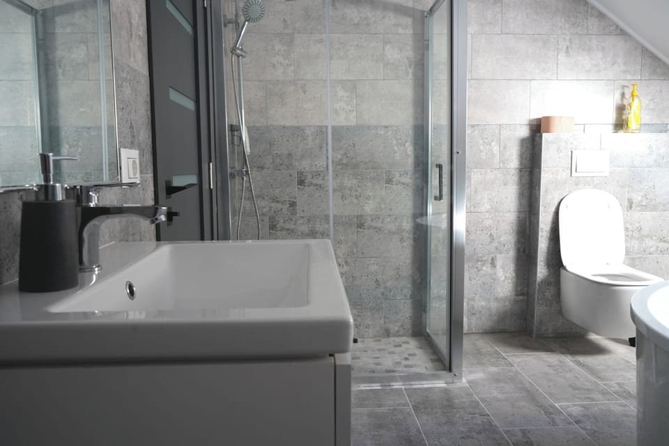 Deluxe Quadruple Room, Mountain View | Bathroom | Separate tub and shower, hair dryer, slippers, towels