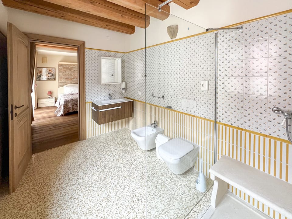 Shower, hair dryer, slippers, towels