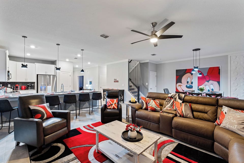 Living area with reclining sectional and two recliners to relax.