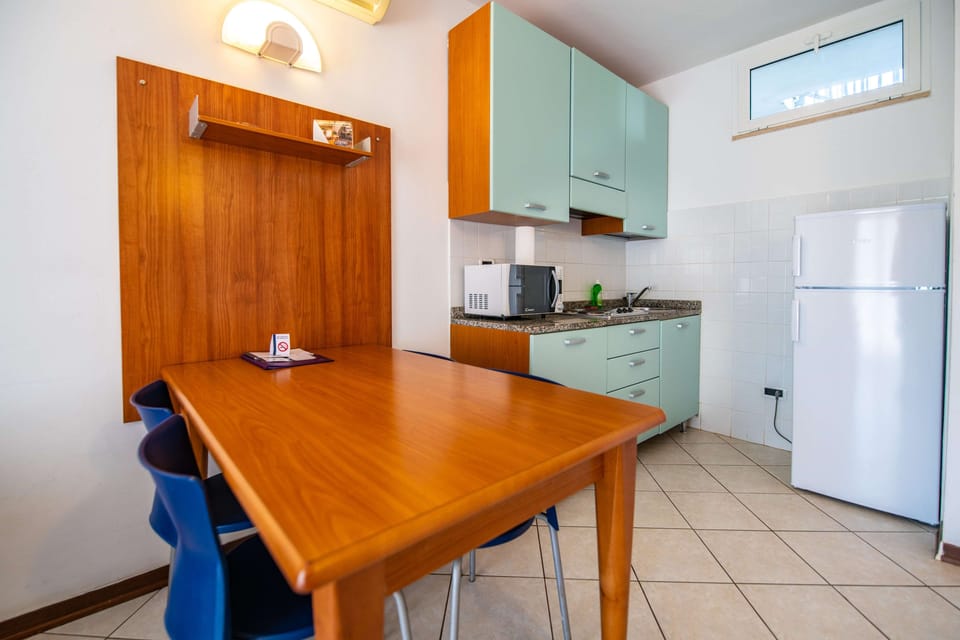 Classic Apartment, 1 Bedroom, Balcony | Private kitchenette | Full-size fridge, microwave, stovetop, electric kettle