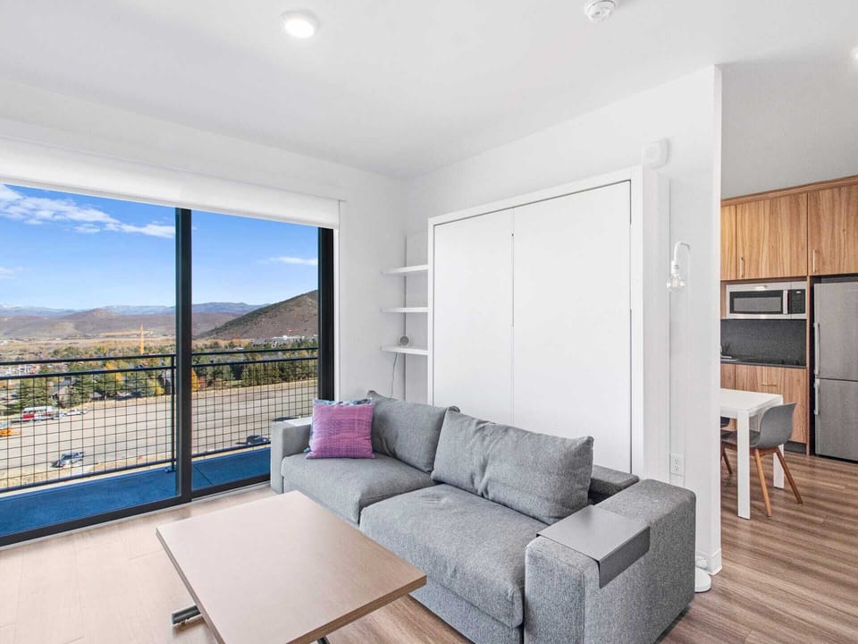 Media living area with queen Murphy bed