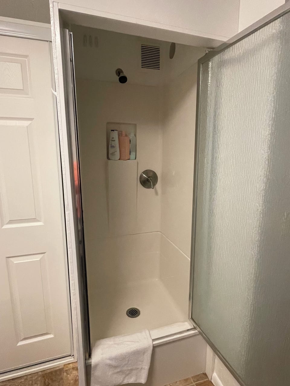Shower cabin with starter soap, shampoo and conditioner. 