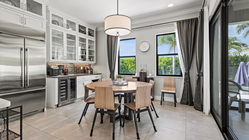 The dining table doubles with a wine bar and expresso station.
