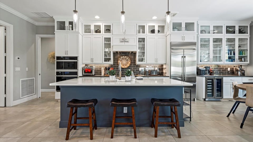 The open floor plan of the living room and kitchen is spacious and perfect for entertaining.