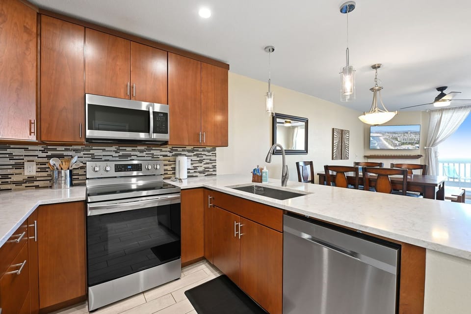 Modern kitchen featuring all stainless steel appliances