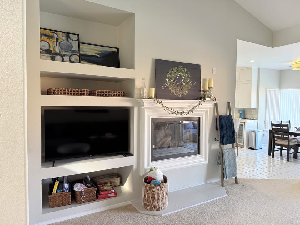 Family room, television, fireplace and games