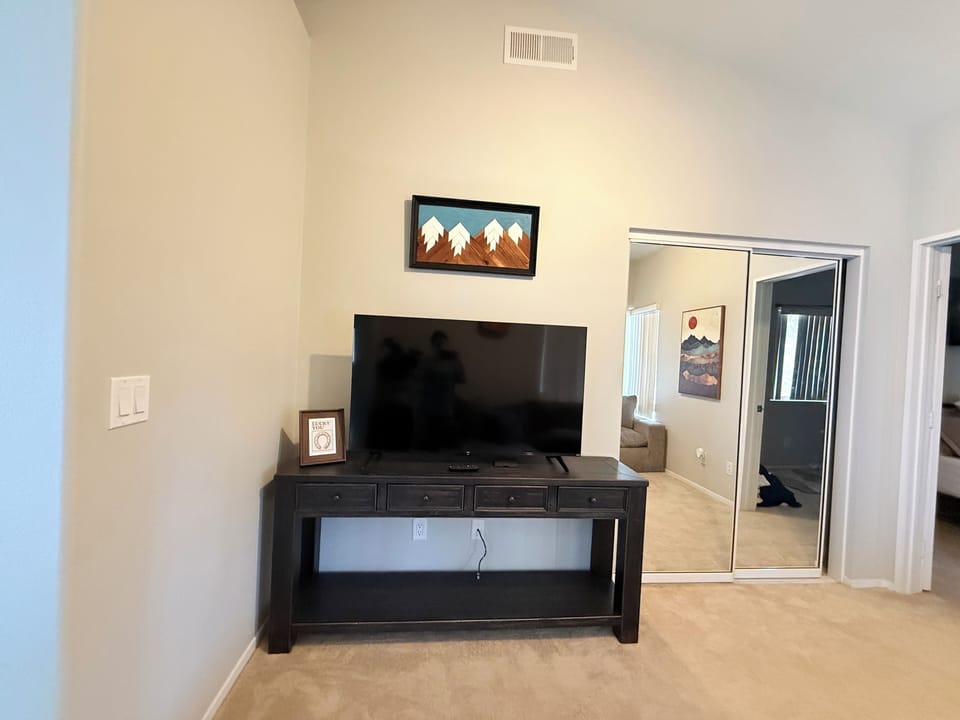 Lounge space attached to guest bedroom with television