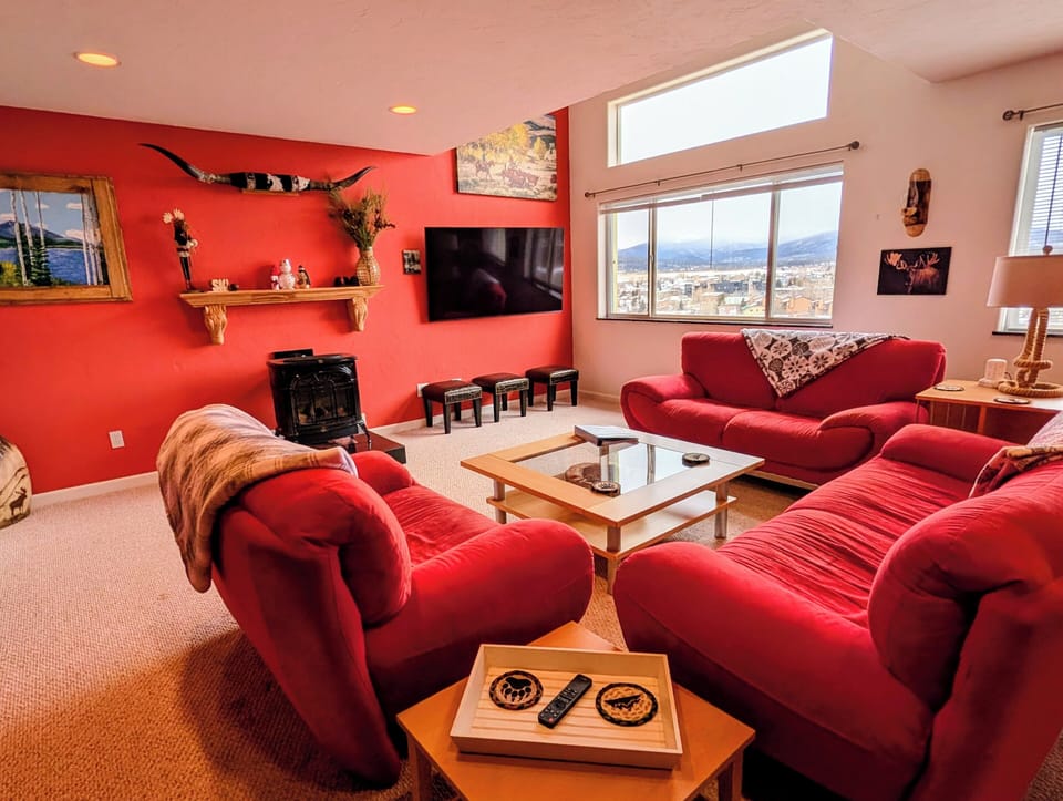 Large, comfortable living room with a gas fire place, TV and an amazing view.