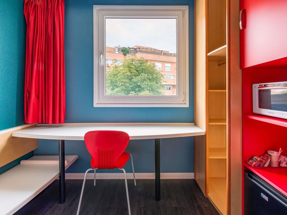 Desk, blackout drapes, soundproofing, iron/ironing board (on request)