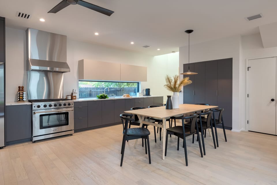 Chic, modern kitchen and dining table for 8. (Primary home)
