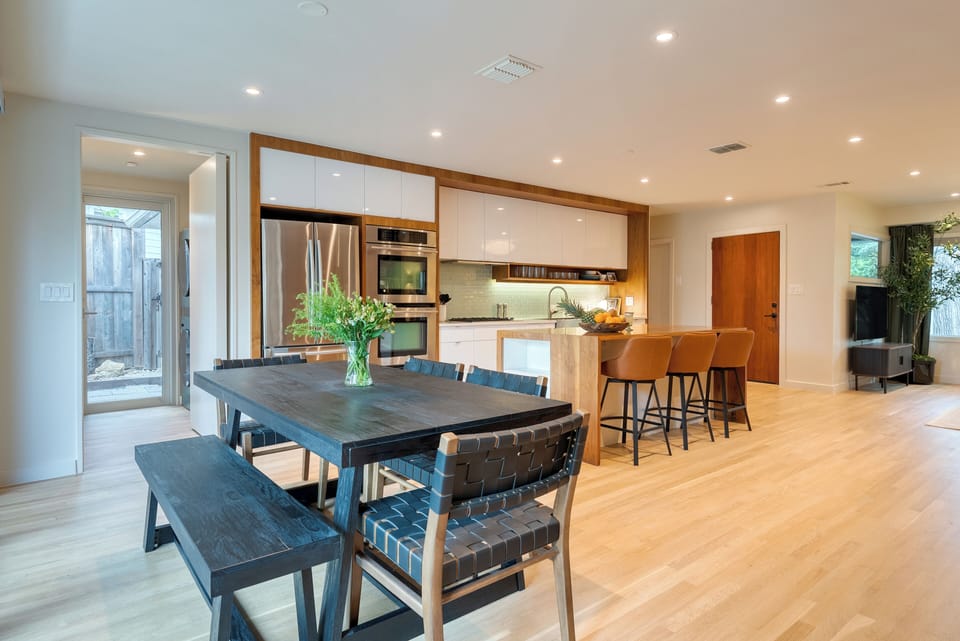 Dining table beside the kitchen island.