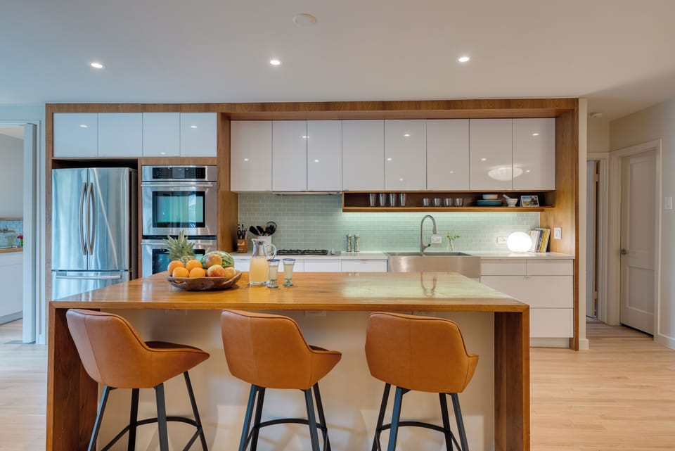 Spacious kitchen with island seating and modern appliances.