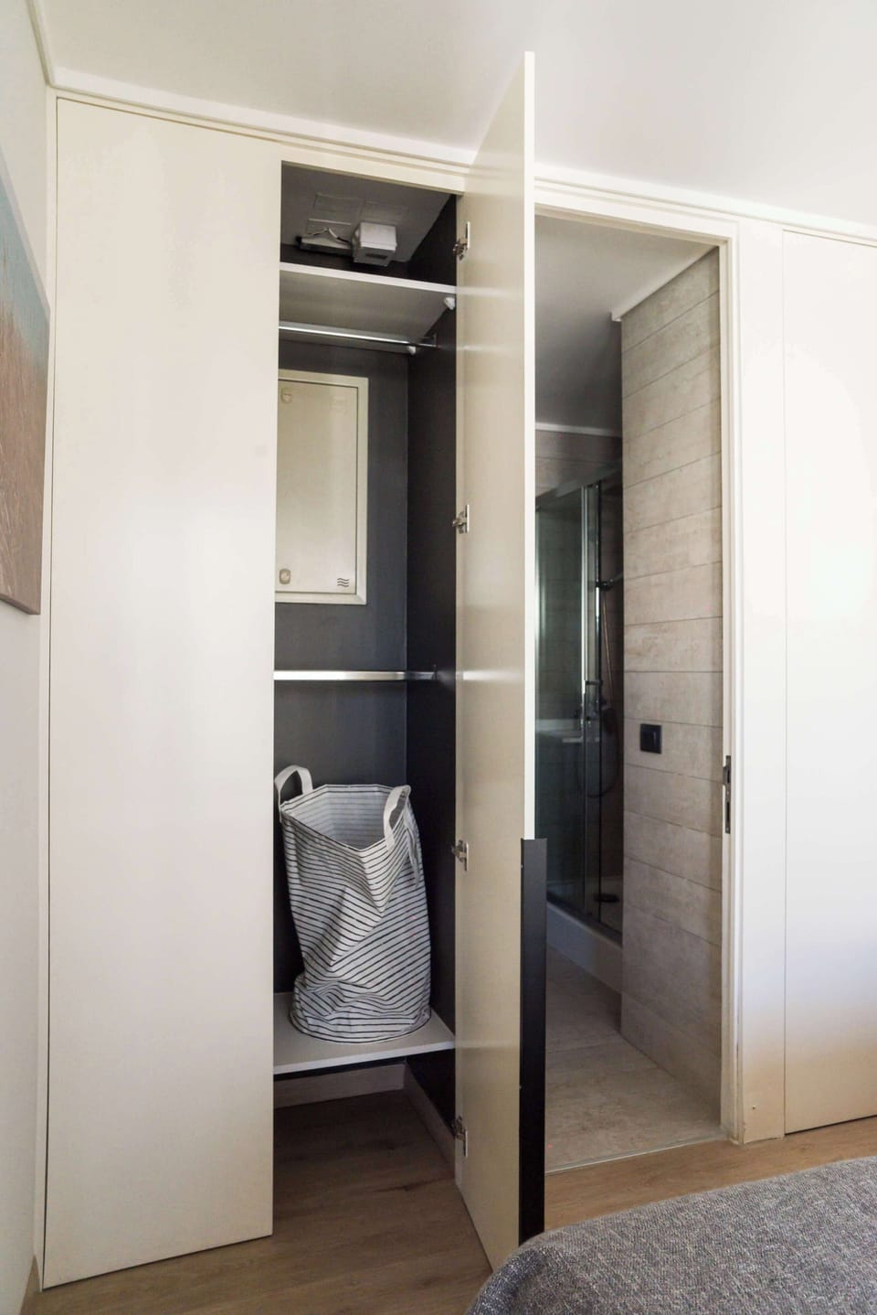 Modern bathroom with convenient closet space, perfect for a comfortable stay.