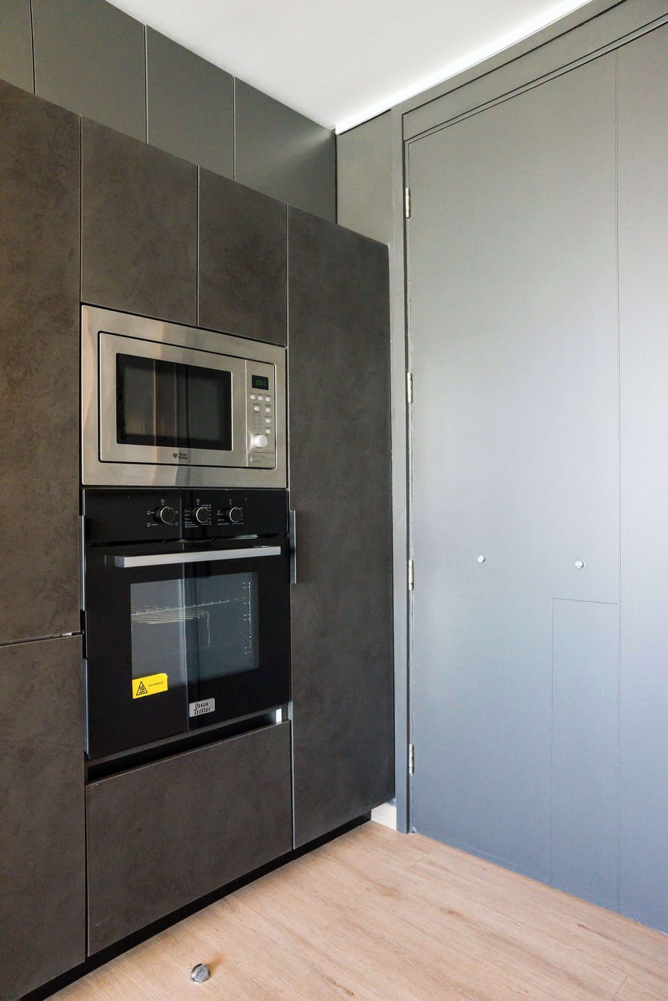 Sleek, modern kitchen with built-in appliances, perfect for cooking your favorite meals.
